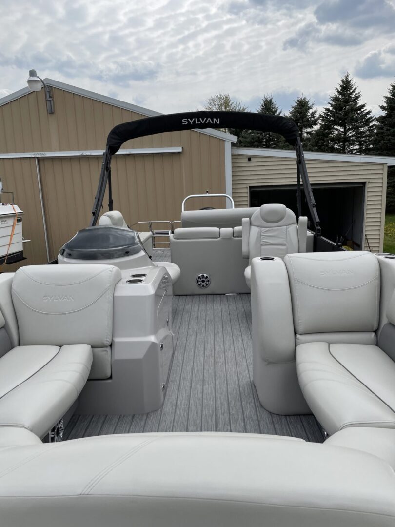 A boat with two seats and a table in the back.