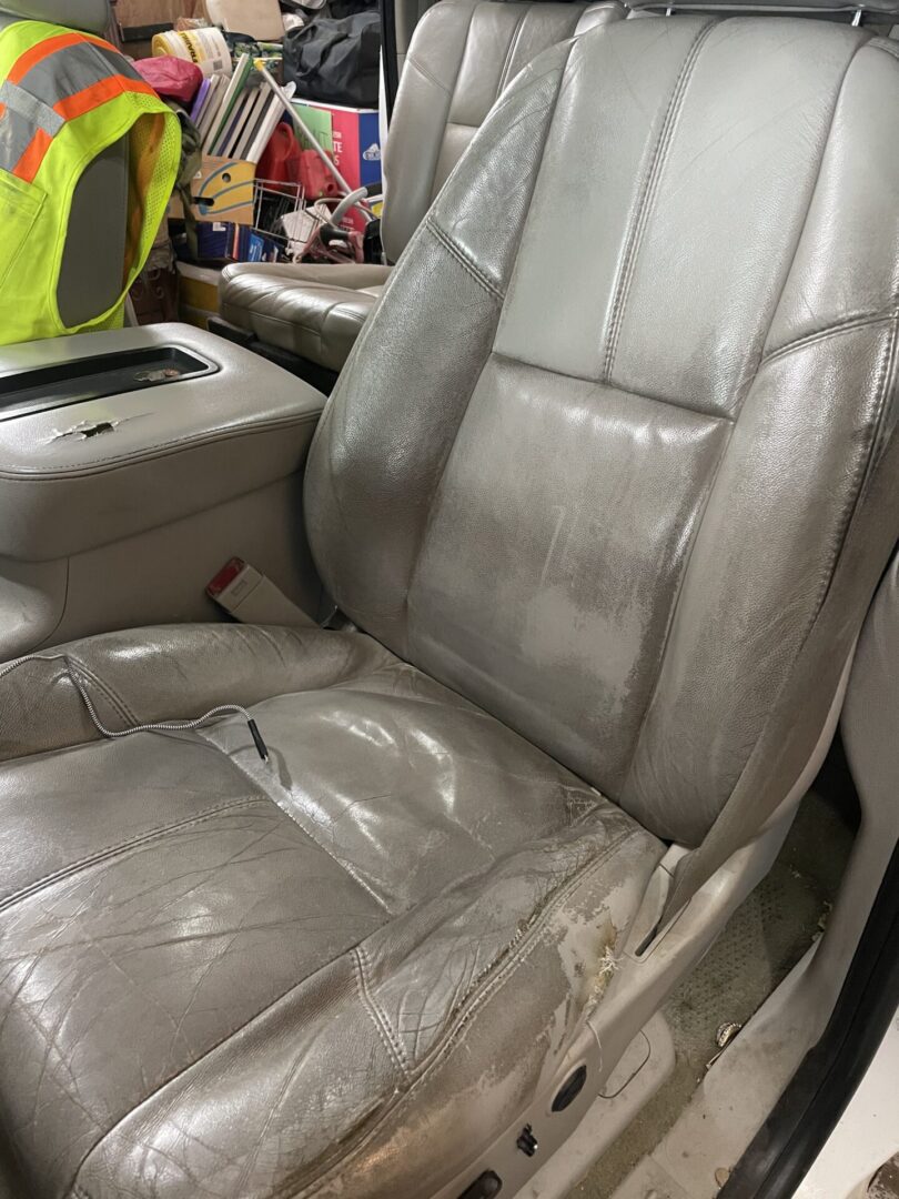 A car seat that is covered in leather.