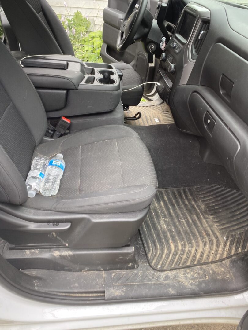 A car with the seat back up and the floor in place.