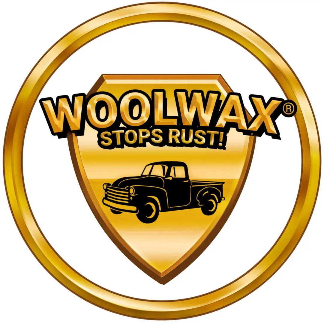 A gold circle with the words woolwax stops rust in it.